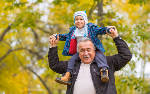 Grandad with granchild on sholders